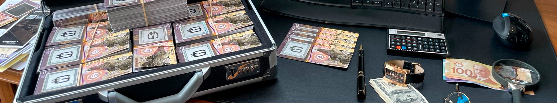 Image of a briefcase full of goldnotes on top of a desk.